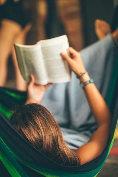 Woman on Hammock Reading Book