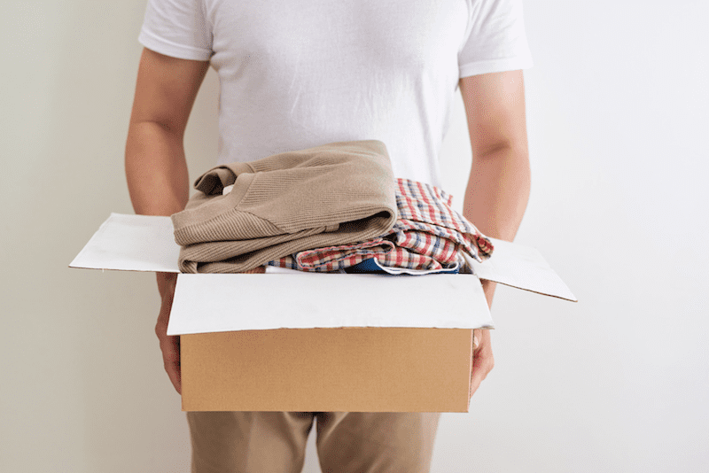 Moving box with shirts folded inside